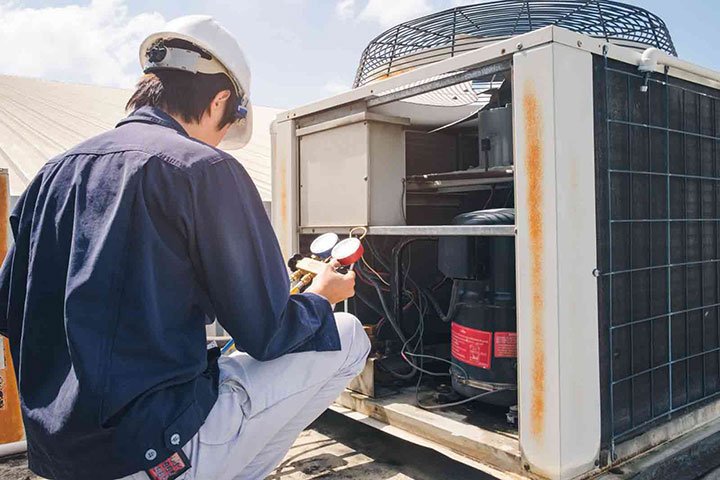 hvac-tech-working-on-ac
